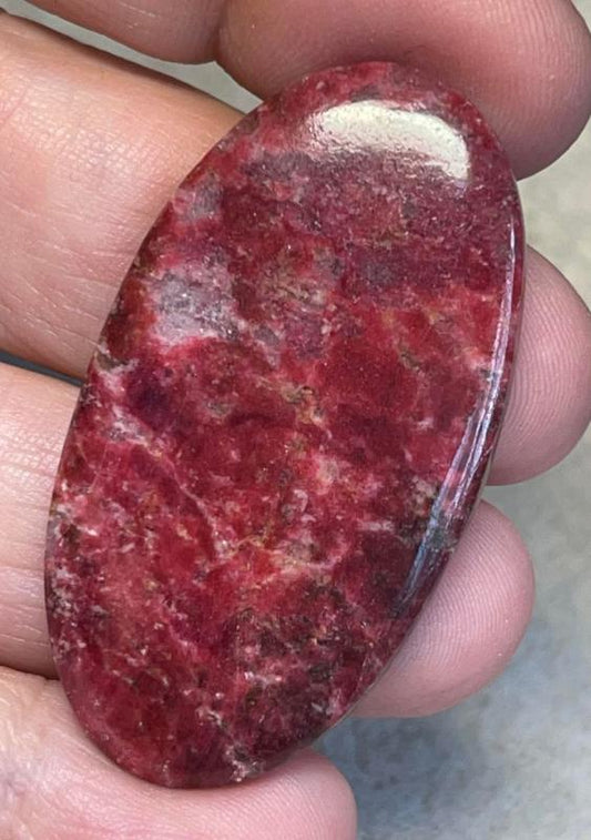 Oval 47x26mm Thulite Cabochon 12