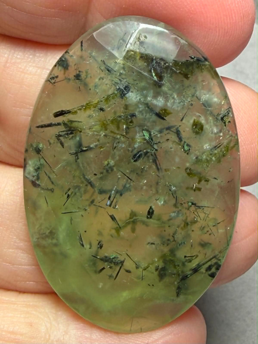 Oval 43x29mm Faceted Prehnite Cabochon 27