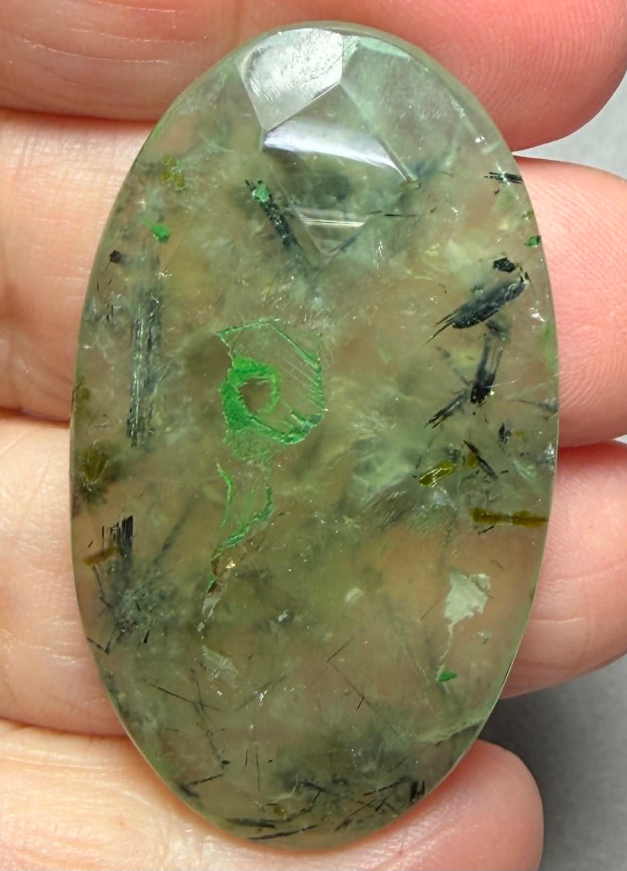 Oval 46x27mm Faceted Prehnite Cabochon 12